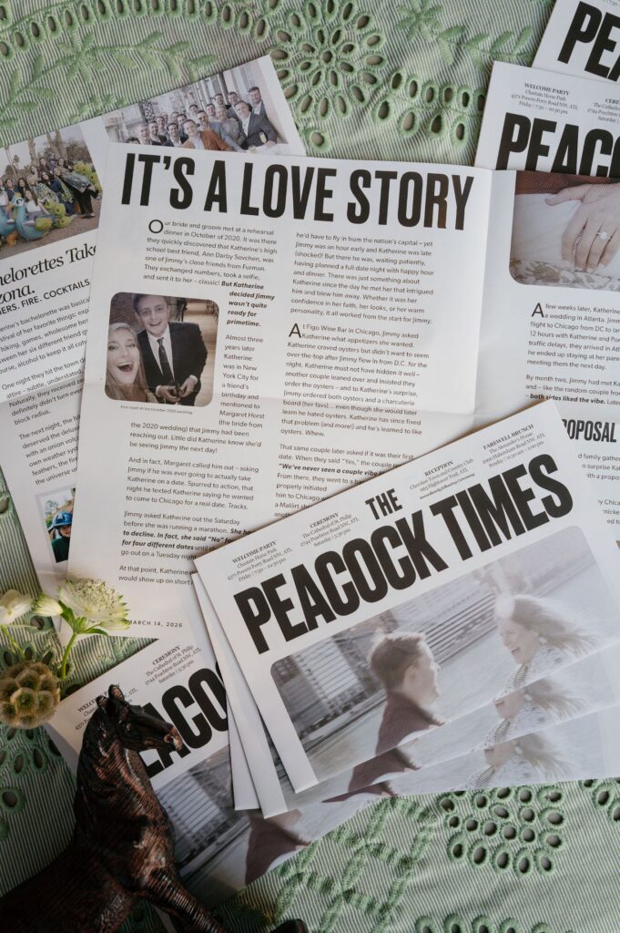Several newspapers titled The Peacock Times and an article called Its a Love Story are spread out on a green textured surface, with a small horse figurine and some white flowers visible in the corner.